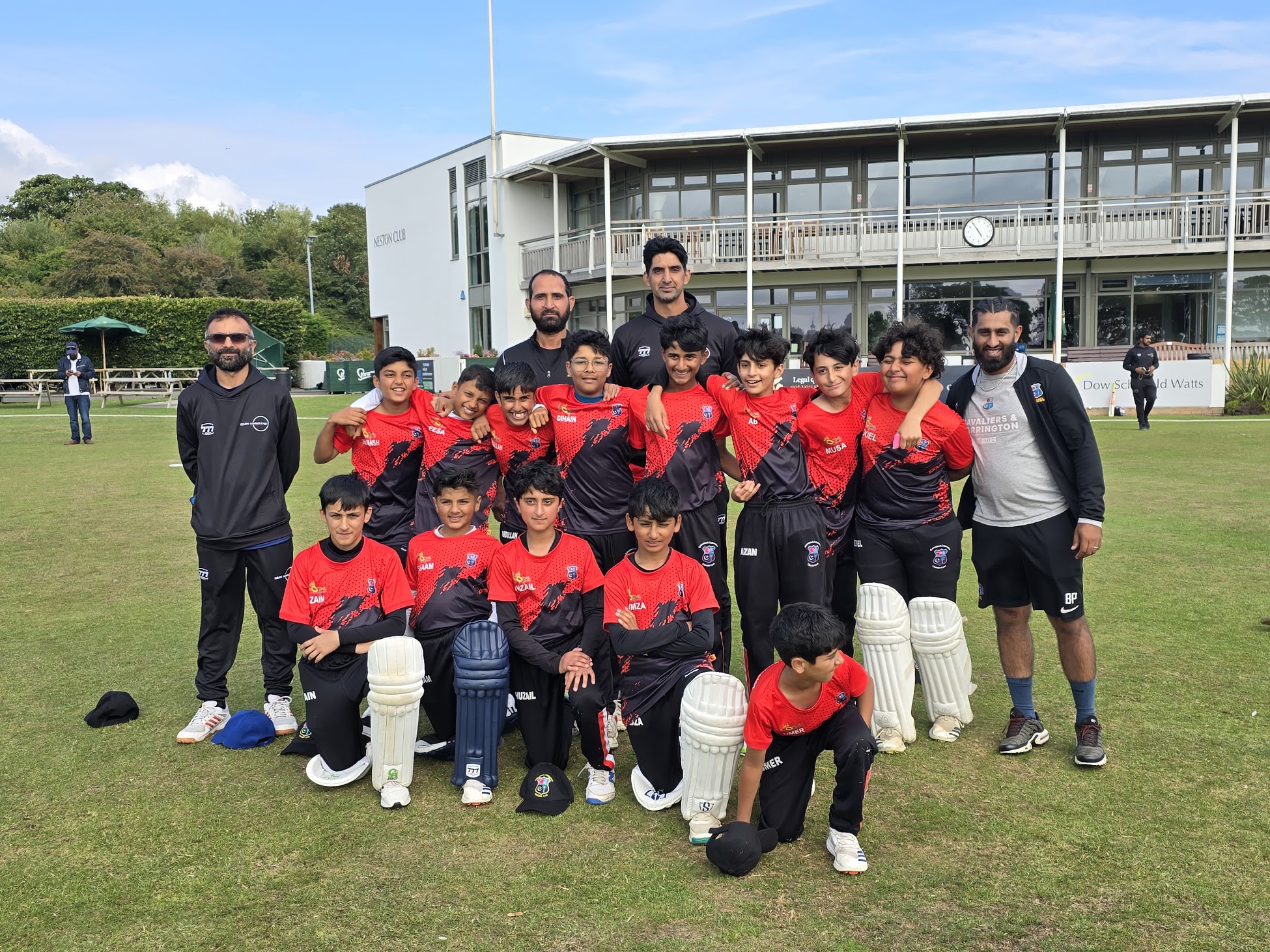 Gemaal and coaches with a junior cricket team